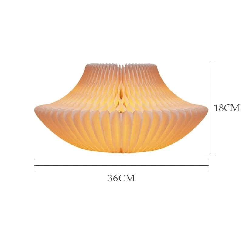 Warm, bell-shaped origami paper bedside lamp, 36x18cm, emits soft, inviting light.